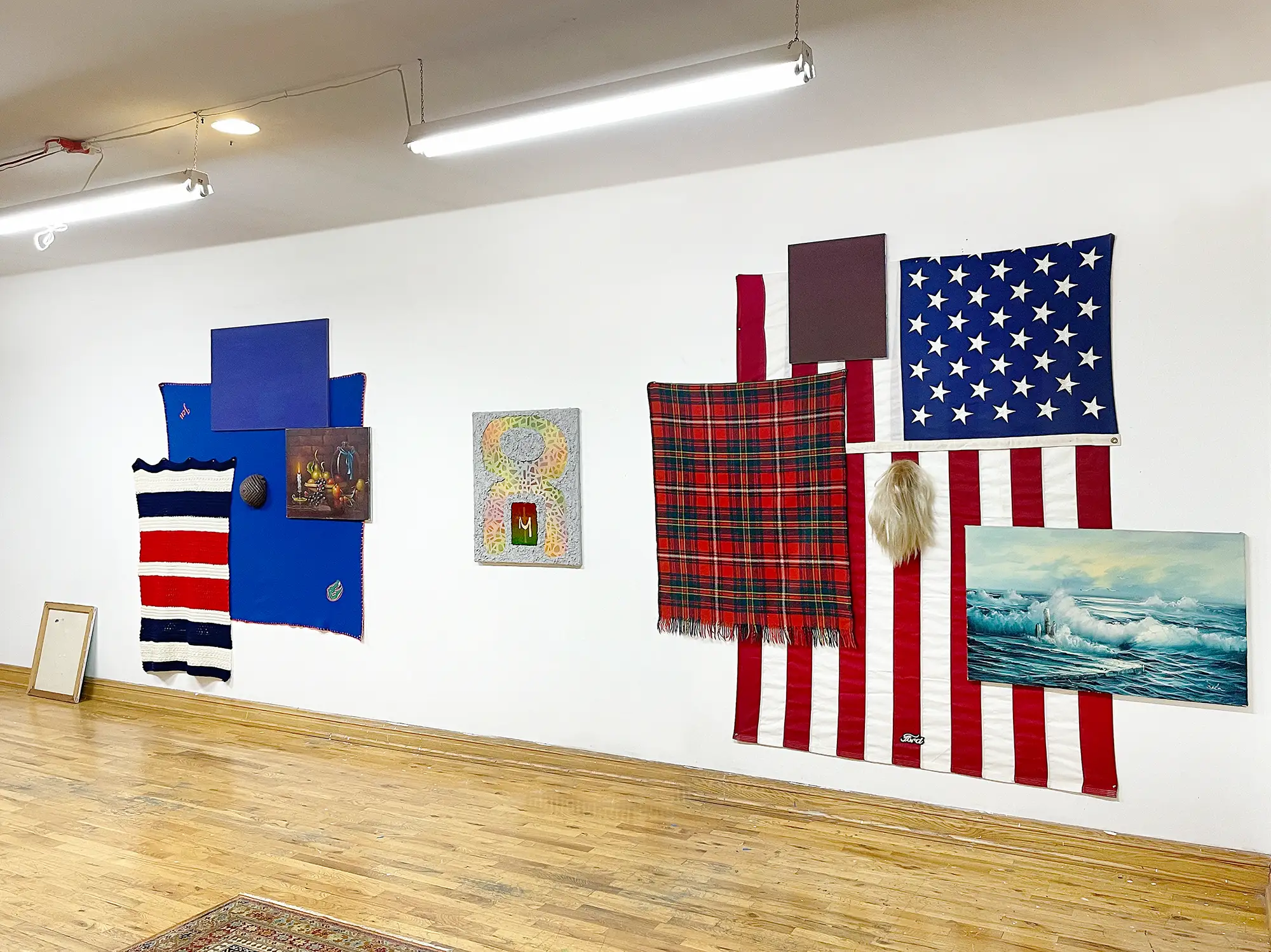carlos charlie perez studio installation with american flags tartan patterns textiles contemporary art