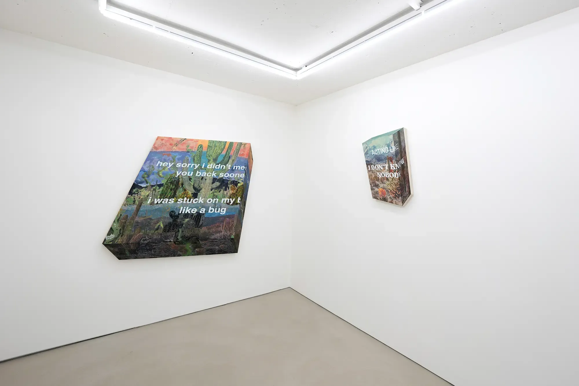 installation view of ho's exhibition at sangheeut gallery featuring text-based mixed media artworks inspired by environmental psychology and cultural identity