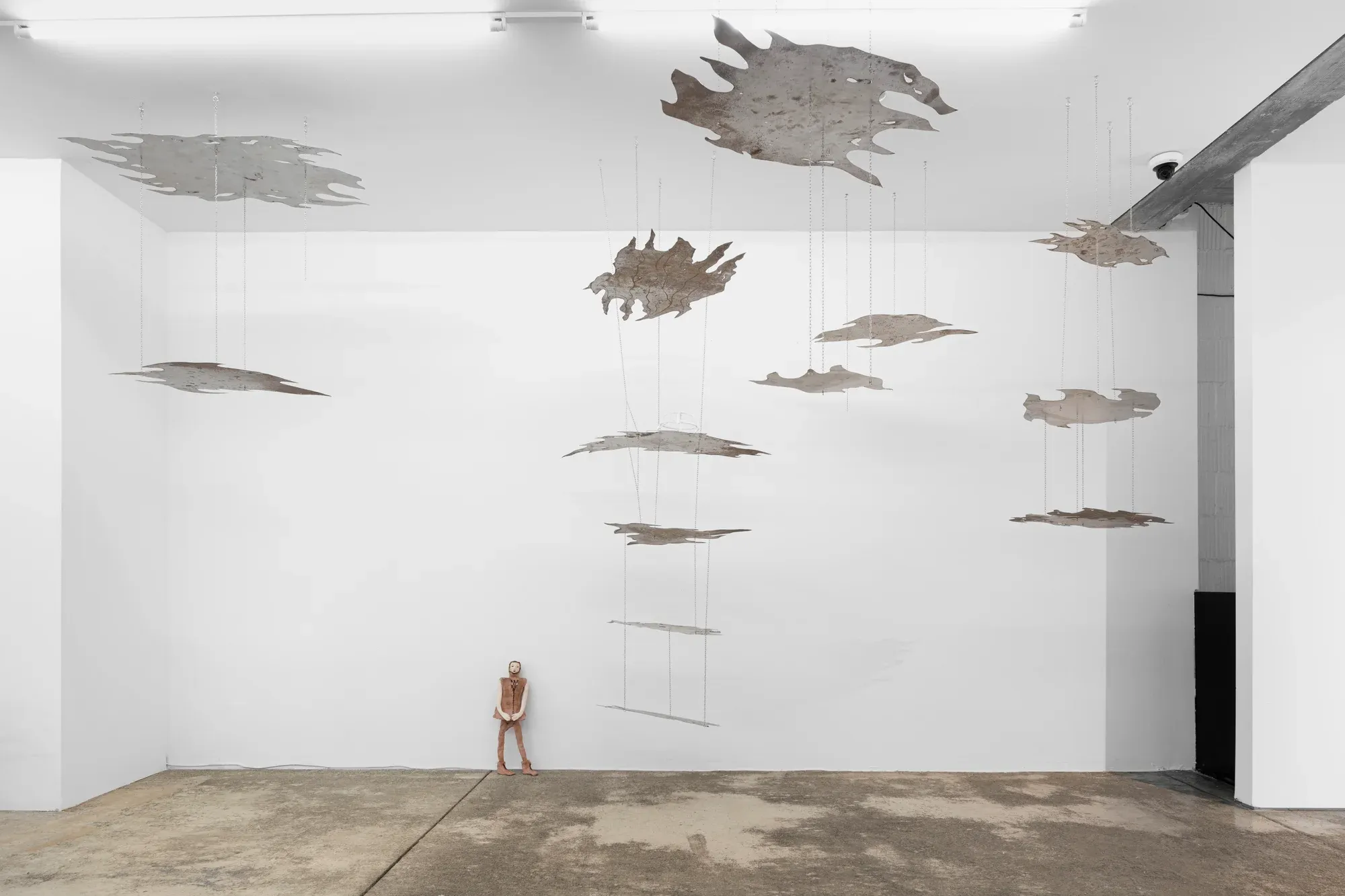 "anna bochkova's aerial sculpture installation at tomas umrian contemporary features textured, floating forms