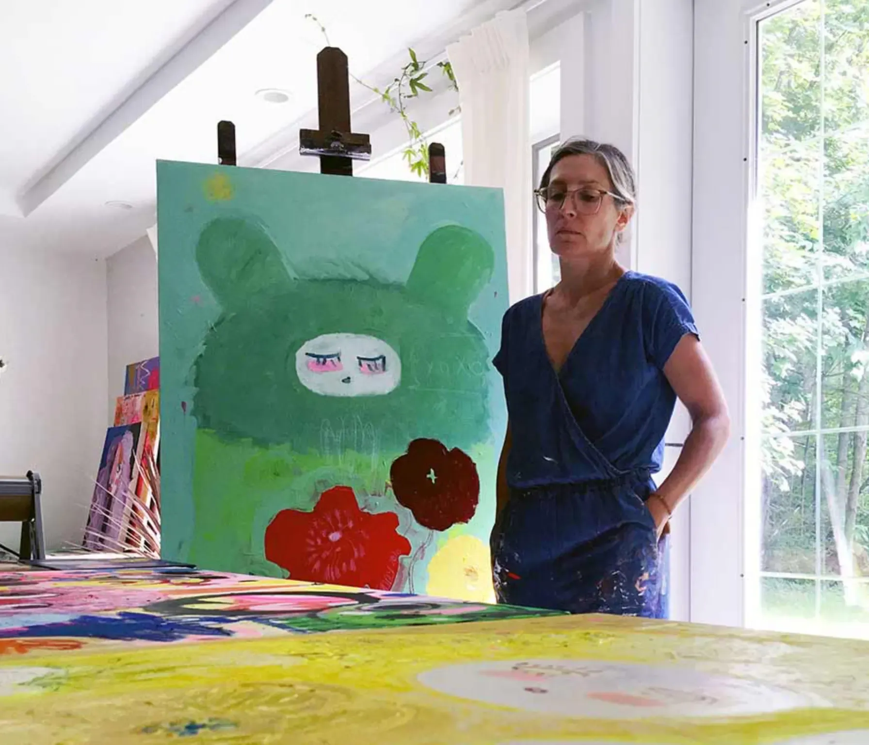 fanny brodar in her studio in maine in front of an new painting 2023